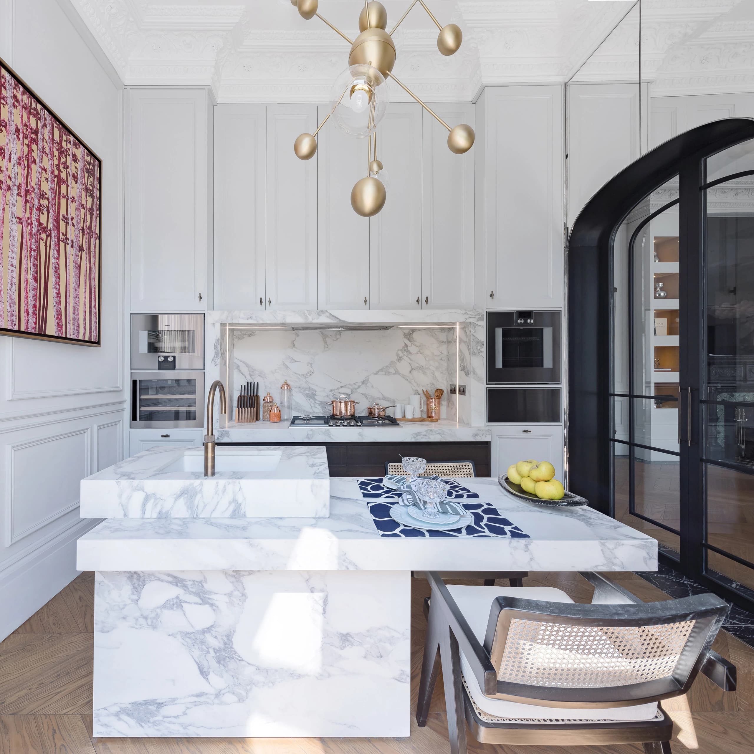 Cor Domi kitchen interior with marble surfaces and arched doorway